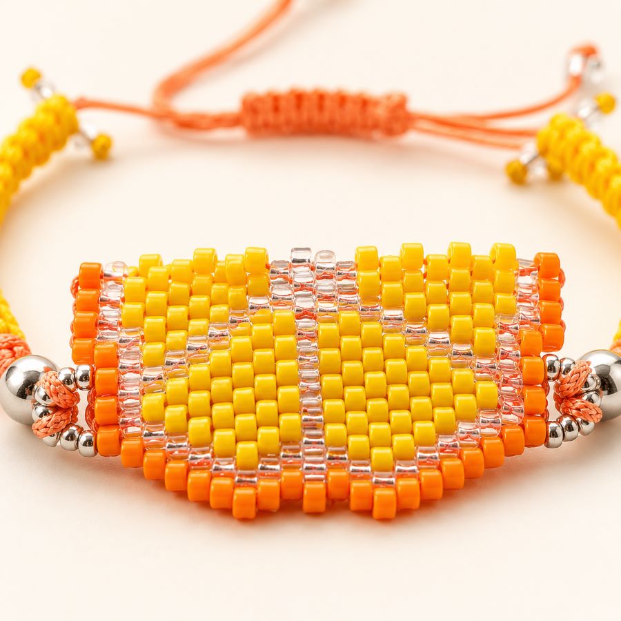 Pulsera Fruta Naranja Miyuki • Joyas Coquetas Detalle macro de la Pulsera Fruta Naranja Miyuki mostrando el tejido artesanal con cuentas japonesas Miyuki Delica, hecha a mano por Joyas Coquetas en Málaga.